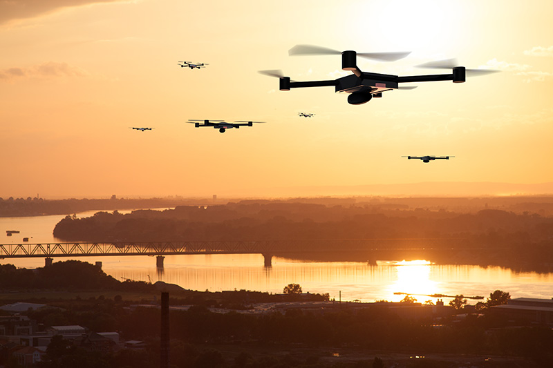 Concept art of a drone swarm surveying an area. 